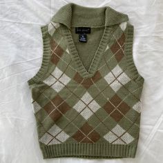 Women’s Collared Vneck Pullover Vest. Made From 100% Acrylic. Lightweight And Brand New. Great For Layering For Fall. Woman’s Vest, Plaid V-neck Tops For Fall, Trendy Green V-neck Sweater Vest, Retro V-neck Winter Tops, Retro Green V-neck Sweater, Trendy Plaid V-neck Top, Trendy Cotton V-neck Sweater Vest, Womens Sweater Vests, Cute Vests