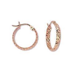 Styled in 14K rose gold, these hoop earrings for her are textured with a striking diamond-cut pattern. The earrings secure with hinged backs. Rose Gold Round Diamond Cut Huggie Earrings, Elegant Hammered Rose Gold Hoop Earrings, Rose Gold Diamond Cut Hoop Earrings, Rose Gold Small Hoop Earrings With Diamond Cut, Jewelry Hoop Earrings, Tube Hoop Earrings, Jared The Galleria Of Jewelry, Earring Backs, Diamond Cut