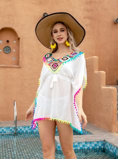 Accentuate your summer vibe! Introducing our ethereal white cover-up, a masterpiece of beachside fashion. Its sheer fabric whispers against the skin, offering a tantalizing glimpse of your swimwear while providing a tasteful layer of modesty. The deep V-neckline, cinched at the waist, flatters every figure, drawing attention to the delicate drawstring tie adorned with tiny, charming beads. The billowy sleeves add a touch of whimsy and sophistication, allowing for a comfortable fit as you stroll Summer Elegance, White Cover Up, Billowy Sleeves, Summer 2025, Push Up Swimsuit, Bold Accessories, White Cover, Swimsuit Fashion, Sheer Fabric