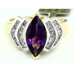 Carat: 10k Yellow Gold (Not Plated) Shape: Marquise Net Weight: 2.65 Grams Finger Size: 7.5 Gem Type: 1 Genuine Amethyst - 1.98 Carats Amethyst Grades: Hue . . . Purple Tone . . . Medium Dark Saturation . . . Vivid No Inclusions Or Flaws 20 Genuine Diamonds - 0.43 Carats Diamond Grades: Clarity Grade . . . Si1 Color Grade . . . G Cut . . . Excellent Type Of Setting: Prong Dimensions: 10 Mm X 5 Mm - Gemstone Measurements Beautiful Gold Rings, Grey Sapphire, Purple Tone, Brooch Art, Yellow Gold Color, Wedding Diamond, Pendant Ring, Wedding Brooch, Ladies Ring