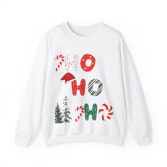 Perfect Holiday sweatshirt. HO HO HO  A unisex heavy blend crewneck sweatshirt is pure comfort. These garments are made from polyester and cotton. This combination helps designs come out looking fresh and beautiful. The collar is ribbed knit, so it retains its shape even after washing. There are no itchy side seams on these sweaters.  .: Made with a medium-heavy fabric blend of 50% cotton and 50% polyester (8.0 oz/yd² (271.25 g/m this sweatshirt feels cozy and is the perfect choice for those col White Letter Print Sweatshirt For Holidays, White Christmas Sweater With Graphic Print, White Cotton Christmas Sweatshirt, White Christmas Graphic Print Sweater, Sweatshirt And Shirt Outfit, Cute Christmas Sweaters, Christmas Crewneck Sweatshirt, Cute Christmas Sweater, Christmas Crewneck