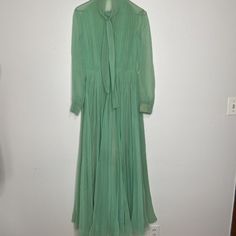 Vintage Miss Elliette 70s Semi Sheer Long Sleeve Pleated Maxi Dress Green Marked Sz 8 , Chest 38" Waist 25", Sleeve Length 24", Dress Length 59" Great Condiiton Made In The Usa See Through Sheer, The Skirt Has An Attached Under Slip Vintage Green Maxi Dress For Evening, Retro Long Sleeve Evening Vintage Dress, Retro Long Sleeve Vintage Evening Dress, Vintage Spring Dress For Work, Vintage Dresses For Spring Workwear, Spring Vintage Dress For Formal Occasion, Spring Vintage Formal Dress With Lining, Mid-century Style Spring Formal Dresses, Spring Pleated Vintage Dress For Formal Occasions