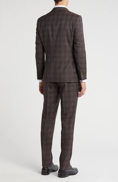 Classic notched lapels smarten the jacket of this trim-fit suit paired with flat-front trousers and finished in a handsome plaid print. 35 1/2" inseam; 10 1/2" rise (size 40R) Jacket has notched lapels; chest welt pocket; front flap pockets Unhemmed Lined 90% wool, 10% polyester Dry clean Imported Semi-formal Plaid Suit With Notch Lapel, Tailored Plaid Suits With Welt Pockets, Plaid Suits With Welt Pockets And Suit Collar, Classic Plaid Three-piece Suit For Work, Tailored Plaid Suit With Notch Lapel, Fitted Plaid Blazer With Welt Pockets, Plaid Suit With Concealed Placket For Workwear, Plaid Single Breasted Suits For Business Casual, Plaid Suit With Suit Collar For Business Casual