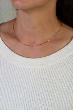 The Elements collection features our solid gold and silver chains, including this beautiful piece which utilizes our long link format in Gold. We believe this is one of the most versatile metal pieces in the collection. This necklace looks amazing all by itself or as part of a layering set. Dainty Cable Chain Link Jewelry, Minimalist Oval Link Chain Necklace For Layering, Timeless Jewelry With Delicate Chain Link, Classic Chain Necklace For Layering, Timeless Jewelry With Delicate Chain, Rectangular Link Chain Necklace For Layering, Rectangular Link Gold Chain Necklace For Layering, Modern Jewelry With Paperclip Chain For Layering, Delicate Chain Jewelry With Rectangular Links