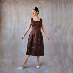 Brocade brown and gold midi dress, vintage asian floral dress, 60s style tea length dress, copper brocade satin formal gown, 80s gold dress Classy and edgy broacade midi cocktail dress with an elegant oriental floral pattern. This dress has a subtle touch of shimmer that gives it an elegant copper effect, perfecto for a dinner or a vintage wedding guest. ⊁ The dress is made from a brocade fabric with an asian influence. The background is a satin dark brown with golden shimmer. ⊁ The dress has a Brown A-line Midi Dress For Evening, Brown Knee-length Midi Dress For Parties, Evening A-line Brocade Dress, Gold Midi Length Evening Dress, Brown Midi Party Dress, Brown Midi Length Party Dress, Brown Evening Dress, Midi Length, Fitted Bodice Tea Length Evening Dress, Gold Brocade Dress For Gala