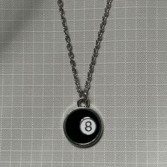 Lucky 8 Ball Necklace ⭑ Water Safe & Tarnish Free Chain ⭑ Available in 3 Different Lengths ⭑ Chain Material - Stainless Steel ⭑ Charm Dimensions - 16mm x 20mm ⭑ UK SHIPPING - Shipping to the UK is completely free with no minimum spend requirement. ⭑ INTERNATIONAL SHIPPING - Shipping to everywhere else in the world is just £3. Any additional items ordered within the same order are shipped with no extra shipping charge. Trendy Metal Necklace With Ball Chain, Retro Metal Necklaces With Adjustable Chain, Retro Metal Necklace With Adjustable Chain, Adjustable Retro Metal Necklace, Trendy Ball Chain Necklace As Gift, Trendy Ball Chain Necklace For Gift, Retro Round Metal Necklaces, Retro Black Metal Necklace, Adjustable Metal Ball Chain Necklace