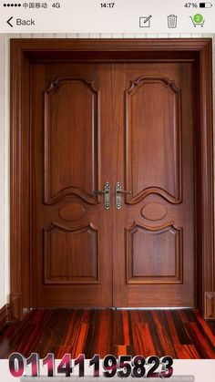 two wooden doors with decorative designs on them