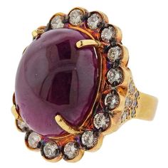 Impressive 18k yellow gold cocktail ring, set with an approx. 40cts ruby cabochon (measuring approx. 21.3 x 16.5 x 10.5mm) , diamonds approx. 1.90ctw. ring size - 8, ring top is 30mm x 25mm. Tested 18k. Weight - 25.9 grams.R-02713 African Inspired Jewelry, Yellow Gold Cocktail Ring, Gold Cocktail Ring, Gold Cocktail, Big Rings, Cabochon Ring, Gold Diamond Ring, African Jewelry, Minerals And Gemstones