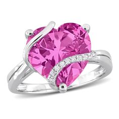 Introducing the captivating Created Pink Sapphire and Diamond Accent Heart Wrapped Ring in Sterling Silver, a stunning symbol of love and elegance. This enchanting ring features a heart-shaped Created Pink Sapphire, totaling 7 1/4 carats, embraced by a delicate wrapping of sparkling Diamond Accents. Crafted with precision in Sterling Silver, the ring exudes sophistication and modern charm. The combination of the vibrant pink sapphire and the shimmering diamonds creates a romantic and timeless de Pink Heart-shaped Jewelry For Proposal, Valentine's Day Open Heart Ring With Diamond Accents, Heart-shaped Diamond Ring With Accents For Valentine's Day, Heart-shaped Diamond Promise Ring For Valentine's Day, Heart-shaped Promise Ring With Diamond Accents, Heart Shaped Promise Ring With Diamond Accents, Pink Heart Ring For Valentine's Day Proposal, Valentine's Day Diamond Accents Heart Promise Ring, Valentine's Day Heart Cut Ring With Diamond Accents