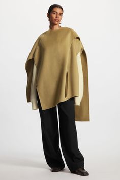 WOOL-BLEND CAPE - Light brown - Outdoor layers - COS Chic Oversized Cape With Batwing Sleeve, Oversized Cashmere Cape With Long Sleeves, Oversized Chic Cape, Oversized Chic Wool Poncho, Chic Shawl Cape For Fall, Chic Long Sleeve Cape For Layering, Cashmere Cape For Layering In Fall, Cashmere Cape For Fall Layering, Fall Cashmere Cape For Layering