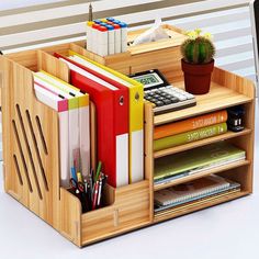 a wooden desk organizer holds books, magazines and other office supplies