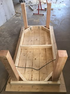 a wooden bench being built in a garage