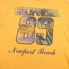 VINTAGE 1989 BYC CALIFORNIA NEWPORT BEACH 89 TEE T SHIRT Mens L Yellow Size Mens L    GOOD CONDITION   100% AUTHENTIC QUALITY MADE The shirt measures from armpit to armpit 20"   and measures from top to bottom 25" The color is: Yellow The fabric content is:  100% Cotton   GM9 The letters above are for us to locate the item in our collection    There are more large photos of this item at the bottom of the page                 About TheBestStuffEver Our goal is 100% CUSTOMER SATISFACTION. We do ou 90s Sports T-shirt For Summer, Vintage Pre-shrunk T-shirt For Beach, Retro Sports T-shirt For Summer, Yellow Retro T-shirt For Summer, Vintage Graphic Print T-shirt For Beach Season, Yellow Beach Graphic Tee, Sporty Yellow T-shirt With Text Print, 90s Summer Sports T-shirt, Vintage Screen Print T-shirt For Beach Season