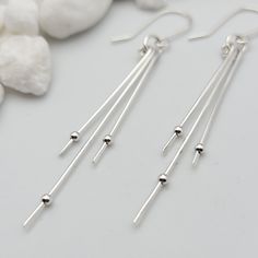 Make a statement in this long, silver dangle earrings. * Approximately 2.5" * Earrings are made from quality Sterling Silver wire and hold tiny sterling beads * Polished to a high shine * Choice of earring packaging with fun quotes! (Picture 3) These are thoughtfully handmade in my mountain studio at time of order, making each one unique. Nothing in my shop is mass produced. Every item is carefully created, packaged and shipped with tracking. Each order is boxed, gift-ready and includes a polish Minimalist Silver Long Drop Threader Earrings, Silver Minimalist Linear Earrings, Modern Silver Hypoallergenic Linear Earrings, Modern Hypoallergenic Silver Linear Earrings, Modern Silver Threader Earrings With Ear Wire, Silver Long Drop Threader Earrings, Silver Long Drop Threader Earrings For Party, Modern Silver Long Drop Threader Earrings, Minimalist Silver Linear Earrings