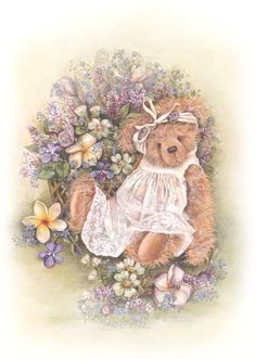 a brown teddy bear sitting on top of flowers