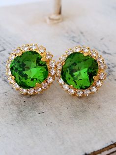 "Green estate Crystal Swarovski rhinestones stud earrings, Bridal earrings, Bridesmaid gifts, Fren green crystal earring, bridesmaids earring Elegant and chic These earrings are so elegant and romantic. They would be great for bridal wedding or for any other day. Perfect gift for bridesmaids or any other occasion. They are made of 14k gold plated studs and Swarovski rhinestones, all set in prong setting. Made with CRYSTALLIZED™ - high quality Swarovski Elements The center stone has chusion fancy Green Cluster Earrings For Wedding, Green Crystal Rhinestone Earrings For Wedding, Green Round Crystal Earrings For Wedding, Green Crystal Earrings For Wedding, Green Rhinestone Crystal Earrings For Wedding, Wedding Green Crystal Rhinestone Earrings, Emerald Gold Earrings, Dark Green Earrings, Gold Earrings Bridal