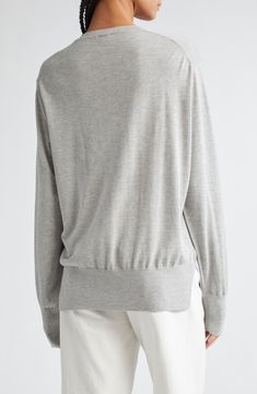 The label's timeless take on fashion defines this relaxed sweater knit from fine-gauge silk and cashmere yarn. 25" length (size Medium) Crewneck Long sleeves Dropped shoulders Ribbed cuffs and hem Side slits 85% silk, 15% cashmere Dry clean or hand wash, dry flat Imported Designer Clothing Cashmere Fine Knit Sweater For Daywear, Chic Merino Wool Top With Ribbed Cuffs, Chic Merino Wool Tops With Ribbed Cuffs, Cashmere Tops With Ribbed Cuffs For Loungewear, Cashmere Fine Knit Sweater For Loungewear, Fine Knit Cashmere Sweater For Loungewear, Fall Cashmere Tops For Daywear, Relaxed Fit Cashmere Knit Top In Fine Knit, Oversized Long Sleeve Merino Wool Top