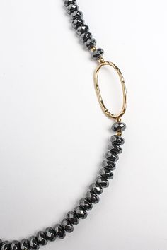 Go bold or go home. Strung with faceted hematite beads which are accented with gold oval hoops, this Kara Hematite Beaded statement necklace has decidedly boholuxe feel. The shimmering onyx druzy pendant frames the beads beautifully for an instant glam! Highlight it against a solid black top. This quality design is part of Mombasa LUXE collection Faceted hematite beads Gold filled oval hoops Onyx druzy pendant Drop: 18" Gold Oval Jewelry With Faceted Beads, Elegant Gold Hematite Jewelry, Gold Oval Necklaces With Faceted Beads, Oval Gold Necklaces With Faceted Beads, Gold Oval Necklace With Faceted Beads, Gold Beaded Necklace With Polished Beads, Gold Oval Polished Beads Necklace, Gold Oval Beaded Necklace With Polished Beads, Gold Oval Polished Beaded Necklace