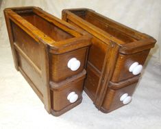 two wooden drawers with white knobs on them