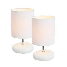 two white lamps sitting next to each other