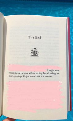 an open book with writing on it in front of a swimming pool and the words, the end