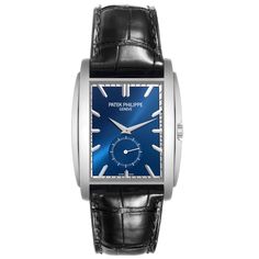 Patek Philippe Gondolo Small Seconds White Gold Blue Dial Mens Watch 5124 Papers. Manual winding movement. 18K white gold rectangular case 43 mm x 33.4 mm. Transparent exhibition sapphire crystal case back. . Scratch resistant sapphire crystal. Blue sunburst dial with raised baton hour markers. White gold dauphine hands. Small seconds sub dial at 6. Blue leather strap with Patek 18K white gold tang buckle. Rectangular Chronograph Watch Accessories For Business, Blue Rectangular Timeless Watch, Timeless Blue Rectangular Watch, Classic Rectangular Watches With Subdials, Timeless Rectangular Watches With Subdials, Elegant Blue Rectangular Watch, Timeless Rectangular Business Watches, Rectangular Chronograph Watch For Business, Modern White Gold Watches With Rectangular Dial