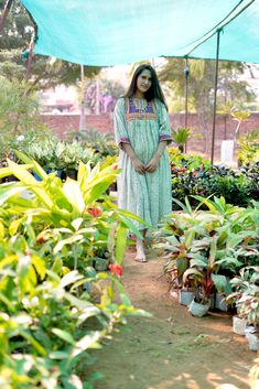 Introducing a beautiful fusion of Embroidery and Indian Hand-block printing Kaveri Midi Dress. A beautiful dress design to enhance every women's beauty. A must have in your wardrobe. This dress will keep you feeling and looking comfortable and fantastic. Simple and stylish design and pretty color make this dress beautiful as well as wearable. Model is wearing Size M. Product details -Fabric: 100% Cotton and Hand-block printed. -Embroidered patch is used on the bodice. -Dry clean or gentle hand wash. -Made In India. Own a Piece of Art Every dress for women of our store is a testament to the rich cultural heritage of Jaipur's block printing tradition. Our passion for this unique art form shines through in every detail. The intricate floral designs dresses tell a story, making your dress more Green Anarkali Dress For Summer, Summer Anarkali Dress With Block Print, Green Printed Dresses For Spring, Green Dresses With Printed Motifs For Spring, Spring Green Dresses With Printed Motifs, Green Spring Dresses With Printed Motifs, Summer Cotton Anarkali Embroidered Dress, Summer Anarkali Cotton Embroidered Dress, Green Bohemian Straight Kurta Dress