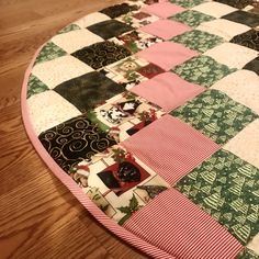 a quilted table top on a wooden floor