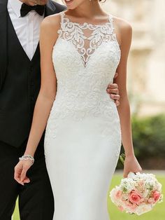 the bride and groom are walking together