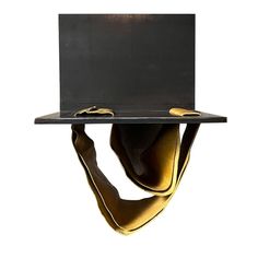 a metal shelf with a square shaped object on it's side, hanging from the ceiling