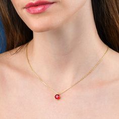 Features * Stylish red necklace with a solitaire pendant on an adjustable 18" chain, including 2-inch extension links. * Gold plated necklace for women with a round red pendant. Simple stone necklaces for women with an 8 mm red cubic zirconia stone. * Gold plated solid silver chain and pendant. This elegant gold necklace for women is made from 18K gold plated 925 Sterling Silver. * Cute gold necklaces for women and teenage girls. High-quality 18K gold plated 925 sterling silver handmade necklace Red Round Necklace For Her, Gift Solitaire Necklace With Round Pendant On Cable Chain, Round Pendant Solitaire Necklace With Cable Chain, Solitaire Necklace With Round Pendant On Cable Chain, Red Round Pendant Jewelry With Bezel Setting, Red Pendant Jewelry With Bezel Setting, Gift Solitaire Necklace With Cable Chain, Red Round Pendant Charm Necklace, Round Solitaire Necklace With Cable Chain As Gift