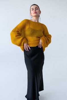 Elevate your wardrobe with our stunning Yellow Chunky Knit Mohair Sweater. Perfect for those who adore cozy, oversized fashion, this sweater combines comfort with effortless style. Features: Material: 67% super kid mohair, 30% nylon, 3% wool.  Crafted from premium mohair blend, this sweater offers a luxuriously soft touch while ensuring warmth and breathability. Design: Featuring a chunky knit pattern, this sweater boasts a relaxed, oversized fit that drapes beautifully. The cropped silhouette adds a modern twist, making it versatile for various outfit styles. Color: Deep yellow, a beautiful rich color that will be the highlight of your look. Style: The fisherman-inspired design includes a loose, easygoing knit that embodies casual chic. Perfect for layering over your favorite high-waisted Slouchy Chic Chunky Knit Sweater, Chic Oversized Mohair Sweater, Chic Oversized Cropped Sweater In Chunky Knit, Chic Oversized Chunky Knit Cropped Sweater, Winter Cropped Slouchy Sweater, Slouchy Cropped Sweater For Winter, Mohair Chunky Knit Sweater For Fall, Oversized Mohair Cable Knit Sweater, Fall Chunky Knit Mohair Sweater