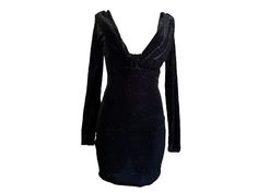 "Vintage 90s mini dress in black velvet with silver metallic glitter through out. Long sleeves with a plunging low V neckline. Stretchy bodycon fit.  Condition: Very good vintage Best fits women's: Small Material: Polyester Lycra  MEASUREMENTS Taken from seam to seam while the garment is lying flat. Double the armpit, waist, and hips Length from Top: 31\" Armpit to Armpit: 19 to 22\" stretches to  Waist: 14 to 17\" Hips: 17 to 21\" Sleeve 25\"" Evening V-neck Glitter Mini Dress, V-neck Glitter Mini Dress For Party Season, Glitter V-neck Mini Dress For Cocktail, Glamorous Holiday Velvet Party Dress, Holiday Velvet Mini Dress For Party, Black Velvet Club Dress, Velvet Mini Dress For Party, Glamorous Velvet Dress For Night Out, Party Velvet Mini Dress