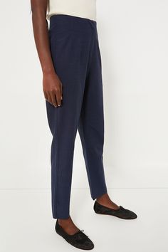 The Navy Callen Pants delivers an elevated take on the classic pant silhouette. Complete with a flattering high rise, stitched double-pleated front detail, concealed zip fly button closure and a v-notch at center back waist providing added comfort. Boasting a figure-flattering fit thats perfect for everyone, dress them down with a basic tee and sandals for a coffee date, or dress them up for desk to drinks with a silky blouse and wedges! High rise Stitched double-pleating detail Concealed zip fl Business Casual Straight Dress Pants With Pull-on Style, Fitted Pants With Seam Detailing For Spring, Fitted Bottoms With Seam Detailing For Spring, Fall Straight Leg Bottoms With Seam Detailing, Office Straight Pants With Concealed Placket, Fall Bottoms With Seam Detailing And Straight Leg, High Waist Pull-on Style Pants For Workwear, Chic Fitted Bottoms With Seam Detailing, Modern Relaxed Fit Bottoms For Formal Occasions