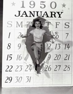 a calendar with an image of a woman in mid - air on it's side