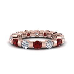 a rose gold band with red and white stones