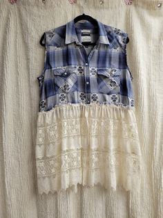 a blue and white shirt hanging on a clothes line