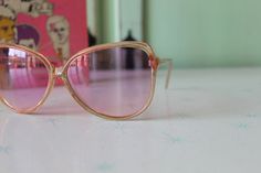 "NOS- new old stock made in taiwan 1970s-1980s lovely tinted lens non prescription lens dreamy retro shades!! amazing style 6\"total width 2 1/2\"lens width 5 1/2\"arms length Thank YOU and please feel free to ask me any ?s:) Have a lovely day xoxo www.etsy.com/shop/retroandme #LOLLIPOP" Retro Plastic Festival Sunglasses, Vintage Pink Sunglasses With Uv Protection, Vintage Plastic Sunglasses With Tinted Lenses, Vintage Sunglasses With Tinted Plastic Lenses, Vintage Sunglasses With Gradient Lenses, Vintage Pink Sunglasses With Mirrored Lenses, Retro Pink Plastic Sunglasses, Vintage Pink Sunglasses For Party, Vintage Pink Glass Sunglasses