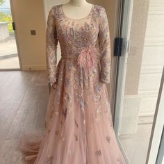 a dress on display in front of a glass door