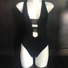 Isabella Rose Black Plunge Neck Strappy Cut Out One Piece Swimsuit Regular Price$148.00 Chic One-piece Swimwear For Night Out, Chic One-piece Bodysuit With Lined Body, Chic Cutout Bodysuit For Pool, Chic Cutout Swimwear For Night Out, Black Cutout Swimwear For Evening, Chic Evening Swimwear With Cutout, Chic Triangle Top Bodysuit For Night Out, Chic Bodysuit With Triangle Top For Night Out, Chic Bodysuit With Lined Body For Vacation