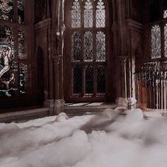 a room with stained glass windows and white foam on the floor