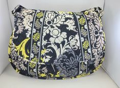 "LARGE VINTAGE VERA BRADLEY CROSSBODY PURSE - \"BAROQUE\" RETIRED PATTERN This large, light weight crossbody purse has 6 pockets for storage, perfect for everyday or travel.   MEASURES 13\"W X 10\"H X 4\"D OUTSIDE - Quilted Vera Bradley tote in a retired pattern called \"Baroque\". It has a lovely, floral & plume pattern in yellow, white & 2 shades of gray on a black background. Wide zippered pocket in the back. Long 50\" strap secured to the purse with silver tone rings (stamped \"Vera Bradley\ Vera Bradley Tote, Vera Bradley, Purses Crossbody, Black Backgrounds, Adjustable Straps, Diaper Bag, Anniversary Gifts, Black And Grey, Silver Tone