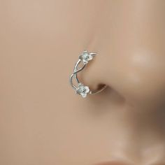 a close up view of the nose piercing on a mannequin's head