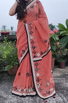 This captivating handloom saree is a masterpiece of elegance, seamlessly blending traditional craftsmanship with contemporary style. Crafted from pure, lightweight cotton, it boasts a harmonious fusion of colors and intricate detailing, making it a versatile choice for various occasions, particularly perfect for the upcoming festive season. The saree's primary hue is a stunning peach, reminiscent of delicate blossoms and a sense of serenity. The body of the saree is adorned with exquisite zari checks, which shimmer with subtle opulence. What sets this saree apart is its captivating patchwork design, featuring three different handblock-printed pure cotton fabrics in black, maroon, and cream colors.  These fabrics come together to create a mesmerizing contrast against the backdrop of the pea Traditional Cotton Pre-draped Saree With Kalamkari Print, Unstitched Cotton Saree With Motifs, Cotton Pre-draped Saree With Printed Border For Festivals, Festive Pre-draped Cotton Saree With Printed Border, Cotton Blouse Piece With Printed Border, Cotton Saree With Motifs, Bohemian Handloom Cotton Saree, Cotton Block Print Pre-draped Saree, Bohemian Handloom Mulmul Saree