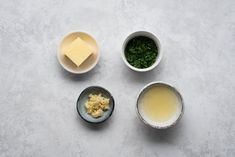 three bowls filled with different types of food