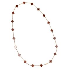 Van Cleef & Arpels VCA Vintage Alhambra carnelian 20 motifs long necklace in 18kt yellow gold, ref. VCARD39800, from 2020, full set with Box and Papers. As each stone is unique, its color and features may vary from one creation to another Faithful to the very first Alhambra® jewel created in 1968, the Vintage Alhambra creations by Van Cleef & Arpels are distinguished by their unique, timeless elegance. Inspired by the clover leaf, these icons of luck are adorned with a border of golden beads. TE Van Cleef & Arpels, Golden Beads, Contemporary Jewelry Design, Van Cleef And Arpels, Diamond Bangles Bracelet, Gold Long Necklace, Carnelian Stone, Diamond Bangle, Van Cleef Arpels