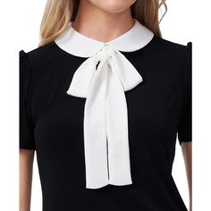 Designed with just the right amount of whimsy, this sweet CeCe top features a Peter Pan collar that ties in a bow that falls from the neckline..Approx. model height is 5'10' and she is wearing a size small.Peter Pan collar with bow detail; back keyhole with button-and-loop closure.Short puff sleeves.Polyester/spandex.Machine washable.Imported Chic Tops With Detachable Bow For Spring, Elegant Tops With Detachable Bow For Spring, Elegant Spring Tops With Detachable Bow, Fitted White Top With Bow Tie, White Fitted Top With Bow Tie, Elegant White Tops With Ribbon, Elegant White Top With Ribbon, Fitted White Blouse With Bow, White Bow Tops For Work