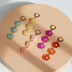 The Posey Flower Dangles are the perfect spring earring! The lightweight acrylic flowers are comfortable and come in a variety of color options to go with any outfit. Posey Flower, Spring Earrings, Acrylic Flowers, Earring Necklace, Burnt Orange, Color Options, Color Pop, Mint, Orange