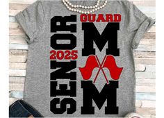 a t - shirt that says guard mom with high heels on the front and bottom