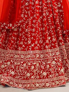 Fill vibrant hues in the upcoming wedding season with our captivating "attractive red embroidered georgette wedding wear lehenga choli" from Ethnic Plus. This stunning red lehenga choli ensemble is the perfect choice for your weddings, receptions, and other special occasions. With its rich red color and intricate embellishments, you are sure to make a lasting impression wherever you go.
The lehenga features a beautiful georgette material adorned with sequin work, zari work, and embroidery detail Red Floor-length Sharara With Zari Work, Unstitched Red Lehenga For Reception, Red Unstitched Lehenga With Traditional Drape, Unstitched Red Lehenga With Traditional Drape, Red Unstitched Lehenga In Traditional Drape, Unstitched Red Lehenga In Traditional Drape, Bollywood Red Unstitched Gown, Red Lehenga With Intricate Embroidery For Eid, Unstitched Red Choli With Intricate Embroidery